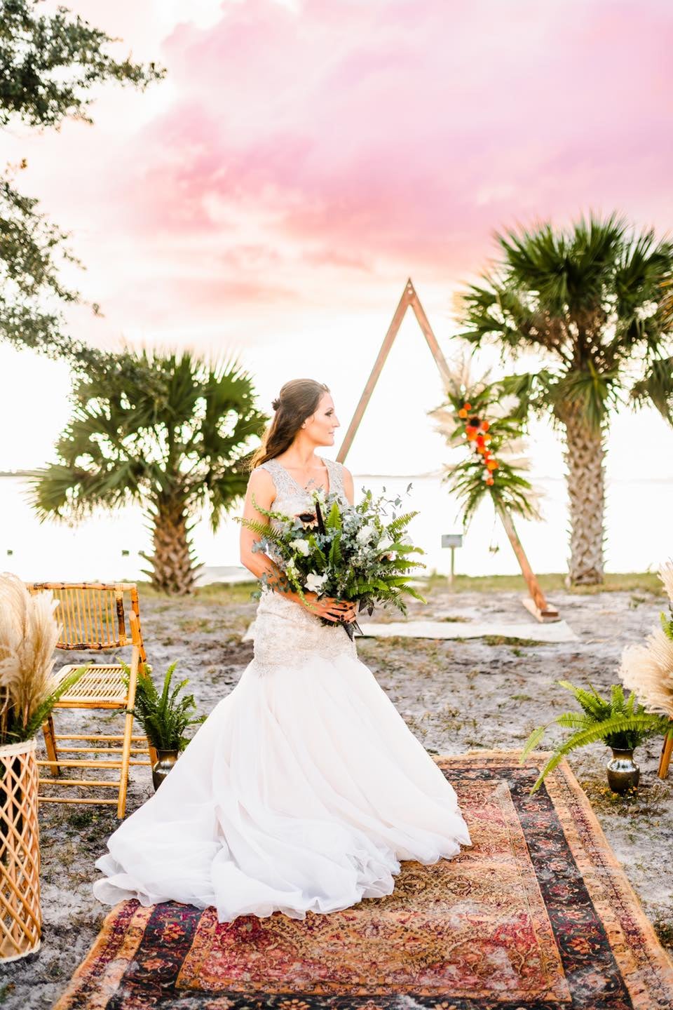 bride posing in boho beach wedding