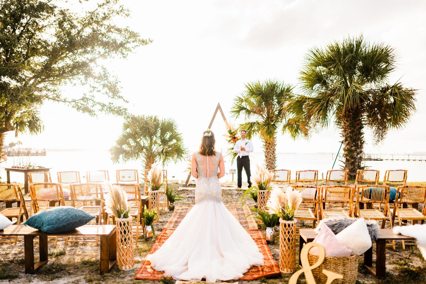 bride walking down aisle in boho beach wedding