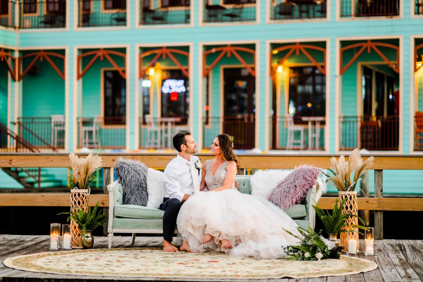 bride and groom sitting on couch