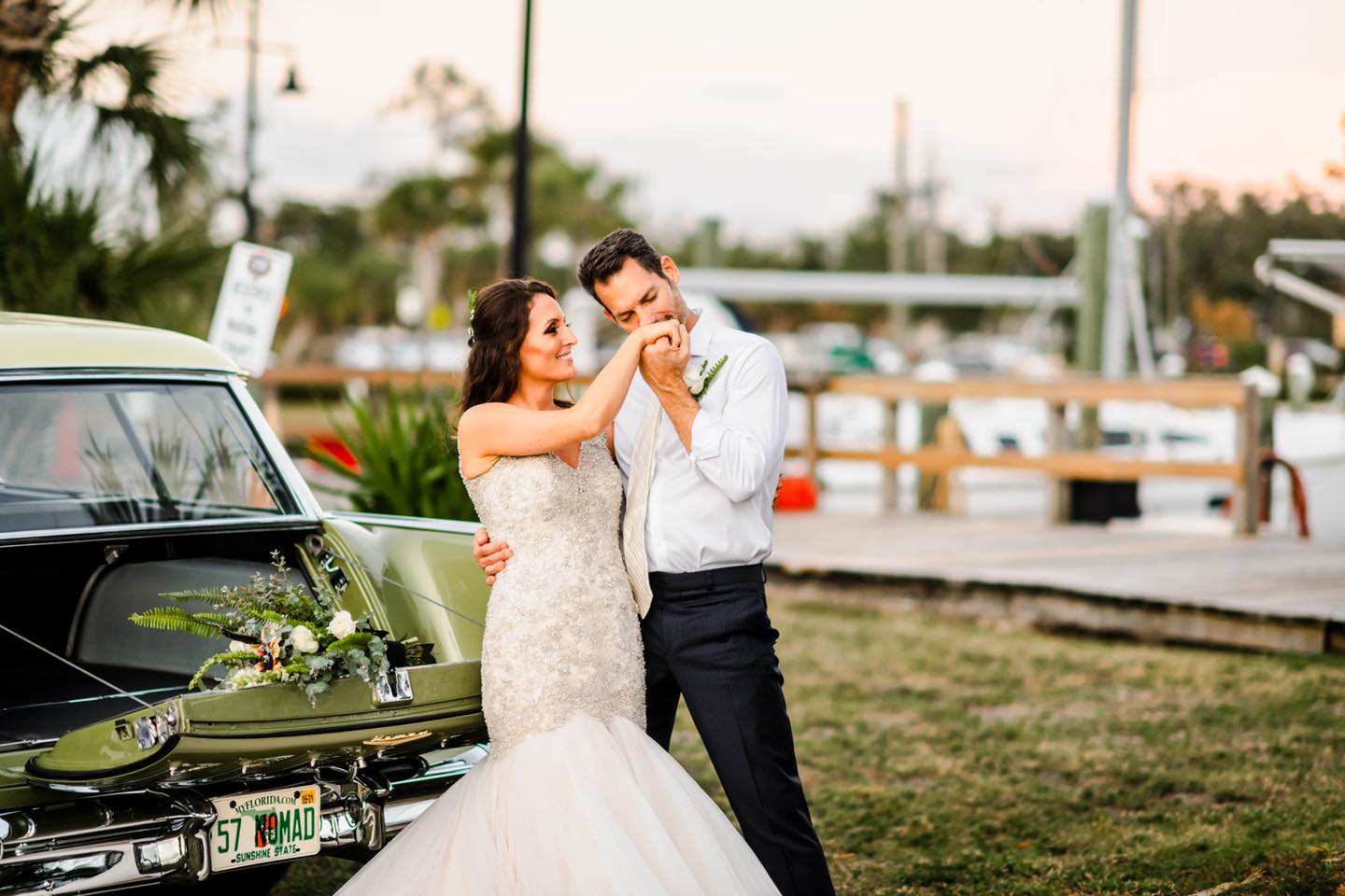 groom kissing bride on the hand