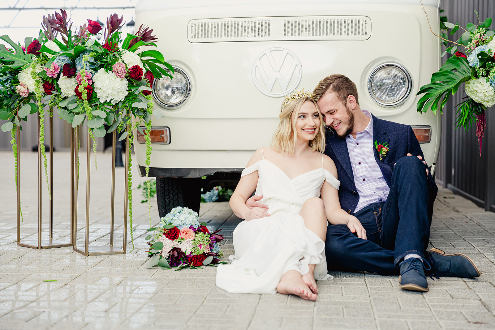 bride and groom posing in front of vintage VW van